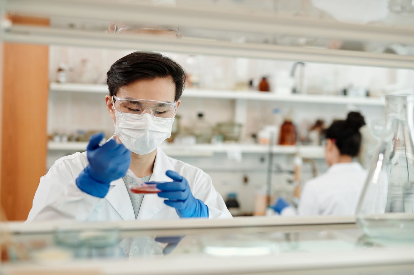 Laboratory technician labelling patient samples