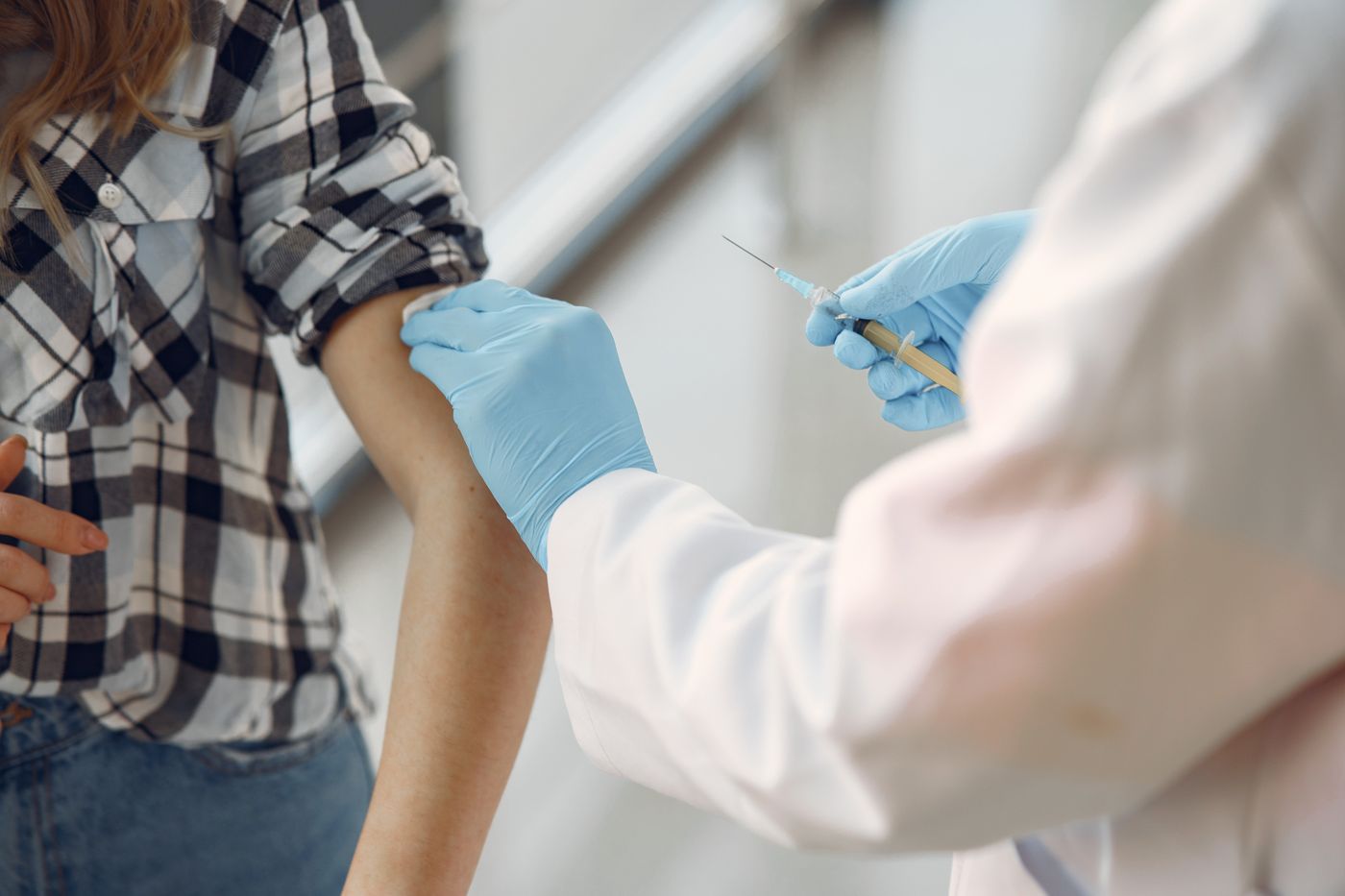 Phlebotomist collecting a blood sample at a patient's home
