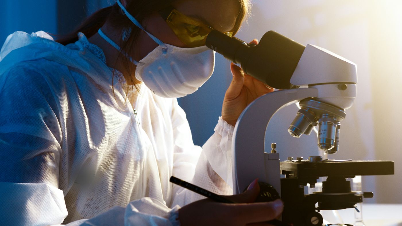 Laboratory technician pipetting a sample for analysis